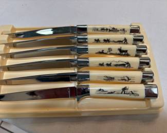 Robert Mayokok scrimshaw steak knife handles from mid-1950’s. Set of 6 never used in original carrier and box.