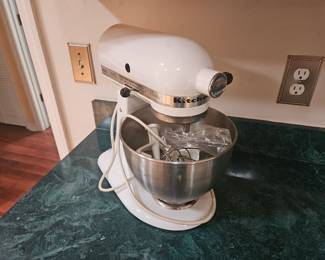 White kitchenaid mixer.  With attachments in bowl $100