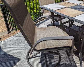 Pair of swivel outdoor dining chairs