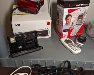 JVC video recorder/camera. Kodak disc camera, cell phone, flip phone