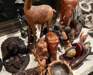 many wooden carved animals