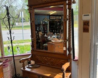 7' tall oak Hall Tree/bench. Barley twist sides, crown molding, apliqued appointments.  It is beautiful.