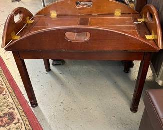 Butlers table.  Top lifts off and sides lie flat to create a tray