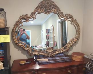 A very large ornate mirror