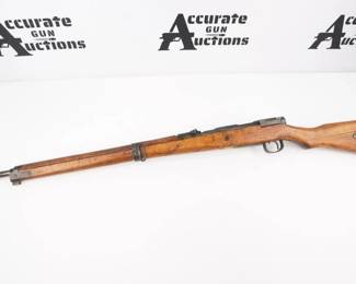 Make: Arisaka
Model: 99
Caliber: 7.7
Action: Bolt
Barrel: 26
Bore: Dark
Serial # 79874
Condition: Good
The Type 99 rifle was a bolt-action rifle of the Arisaka design used by the Imperial Japanese Army during World War II., 7.7mm Arisaka caliber, 25 5/8" barrel, blued finish, internal box magazine, "Mum" is intact. This rifle is in Good condition showing signs of use, Crack in Stock and wear. Sold As Is.