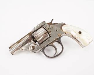 Make: Iver Johnson & Cycle Work
Model: NMN
Caliber: .32
Serial # 56450
This Little Iver Johnson & Cycle works top break revolver is chambered in .32. This revolver is in Fair condition showing signs of rust and use. 