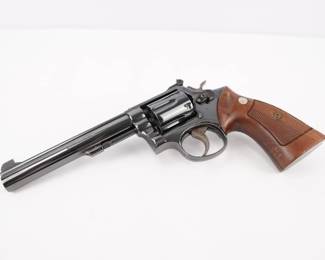 Make: Smith & Wesson
Model: 14-3
Caliber: .38 S&W SPL
Action: DA
Barrel: 6
Bore: Shiny
Serial # 8K19760
Condition: Excellent
The Smith & Wesson Model K-38 Target Masterpiece Revolver Model 14 is a six-shot, double-action revolver with adjustable open sights built on the medium-size "K" frame. It is chambered for the .38 Special cartridge, and most were fitted with a 6 in or 8.75 inch barrel. This Revolver features a 6 inch barrel and is in Excellent condition showing normal signs of use and wear.