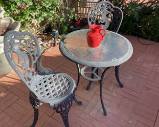 Wrought iron patio table and two chairs