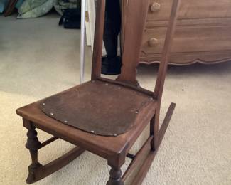Antique leather seat child’s rocking chair
