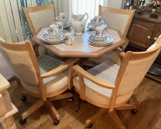 Kitchen table with four chairs and one leaf