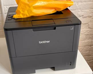 Brother’s Laser printer with extra cartridge.  $200