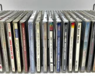 20 Music CDs In Holder: James Taylor, Carly Simon, Beatles, Buena Vista Social Club & More
Lot #: 134