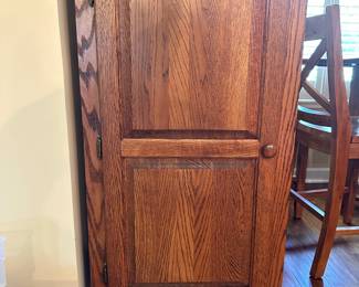 Tall oak storage cabinet