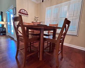 Beautiful bar height, kitchen table has six chairs. When close it is a square when open it is round