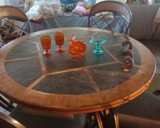 Murano glass on slate topped table. Very sturdy! 