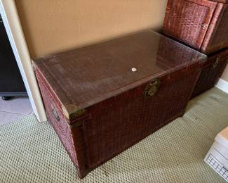 Glass topped, brass-trimmed wicker storage chest with two smaller matching square chests