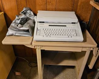 $25 Brother AX 600 word processing typewriter, $8 typewriter stand