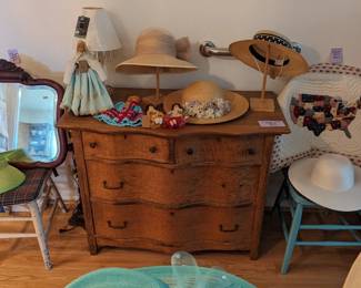Antique small dresser, vintage sun hats, vintage chairs