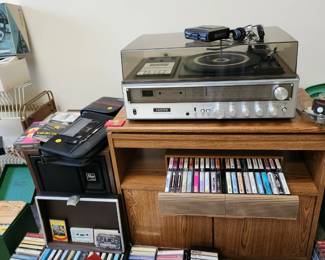 Turntable/cassette player with speakers.  Cassettes, albums & Cd's. MCM record holder. 