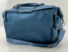 TUMI Blue Leather Trim on Blue Performance Fabric Small Duffel Bag with Shoulder Strap and Signature Charm
