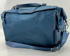 TUMI Blue Leather Trim on Blue Performance Fabric Small Duffel Bag with Shoulder Strap and Signature Charm