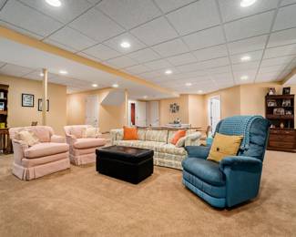 Vintage desk, 2 pink swivel chairs, sofa, lazy boy recliner, ottoman w storage.