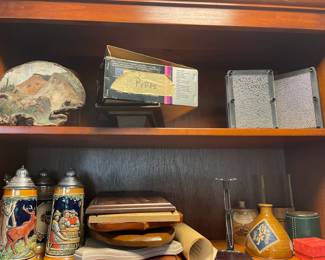 Various items and wooden bookshelves.
