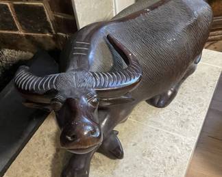 African carved wood sculpture of a water buffalo.