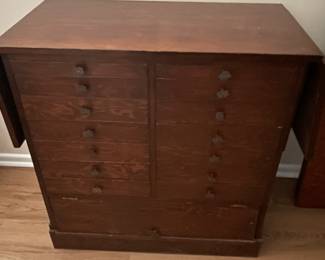 Small cabinet with drop leaves.