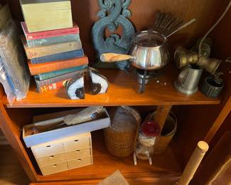 Various items and wooden bookshelves.