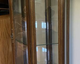 Pair of tall curio cabinets.