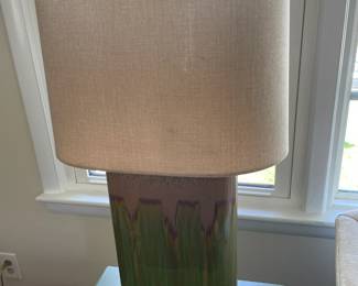 Pair of ceramic table lamps and green end tables.