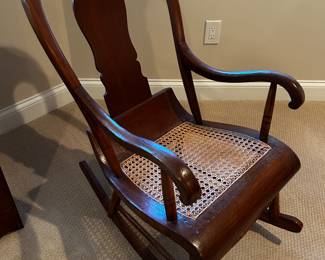 Beautiful antique rocker with cane seat