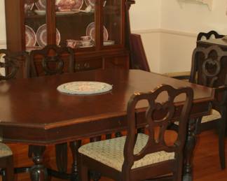Dining table w/extention and padding. 8 chairs...China cabinet by Stanley