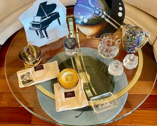 Brass base with glass top coffee table, decorative accessories by Michael Aram, Kosta Boda and Orrefors, signed art glass