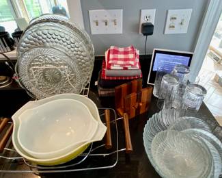 Pyrex bowls, glass platters, linens