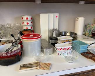 Random kitchen items, lots of mini loaf pans, pie plates, Bowls, sherbet glasses, utensils, waffle maker