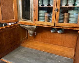 F108 - $550. Very old Hoosier Cabinet with Tin Top. Has original inserts for flour. Very good condition for it's age!