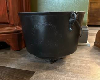 F142 - $40. 3 legged cast iron pot - unmarked but it has been Painted. For display only!