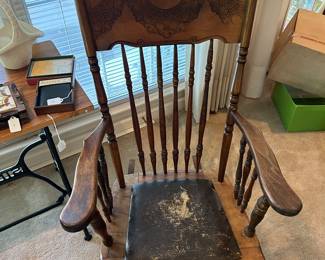 Circa 1900 rocking chair with a leather seat