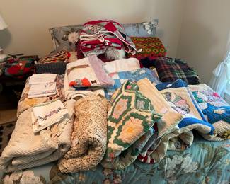 Quantities of handmade quilts