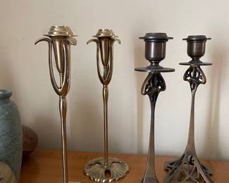 An Assortment of metal glass and pottery candlesticks