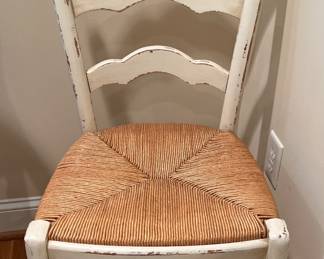 White wooden chair, wicker seat. 