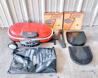 COLEMAN ROAD TRIP PORTABLE PROPANE GRILL WITH COVER AND EXTRA CAST IRON GRILL PLATES