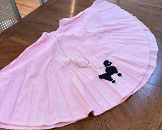Vintage child's hand-sewn pink poodle skirt, elastic waist measures approx. 20" with 25"L