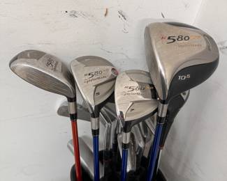 Left-handed golf clubs in bag, Taylormade R580 XD drivers, Hogan Producer irons and bag, comes with several boxes of golf balls