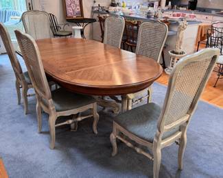 Thomasville Furniture round-to-oval dining table with two 18" leaves making it 6.5 ft. long (42" when round) support legs for when table is extended may need new internal hardware, 6 cane back chairs