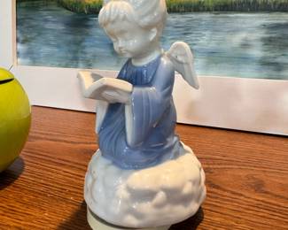 Musical ceramic reading angel figurine (wings have been repaired) 7"