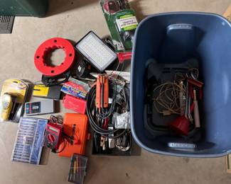 Blue bin of assorted tools including stud finders
