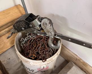 Bucket of heavy and medium-weight chains and come-along